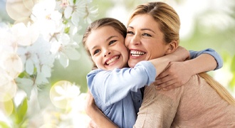 Mom and daughter smiling together