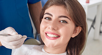 Smiling patient with ceramic, metal-free crowns