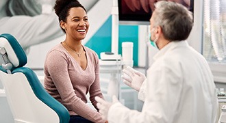 patient talking to cosmetic dentist 