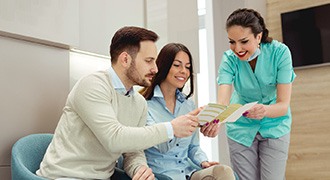 dental professional talking to patients 