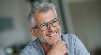 older man smiling with dental crowns in Tyler