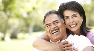 Smiling couple with dentures in Tyler 