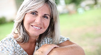 closeup of older woman smiling outside