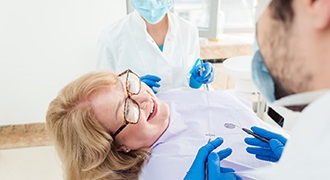 woman smiling while visiting dentist 
