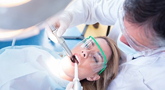 dentist giving root canal in Tyler to young woman 