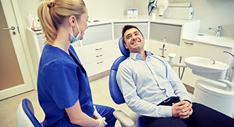 man smiling at his dentist 