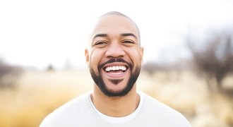 Man smiling outside