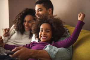 family relaxing on the couch