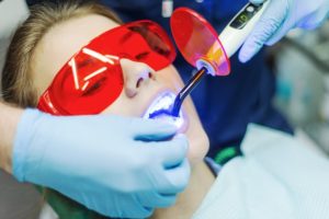 Woman receiving teeth whitening 