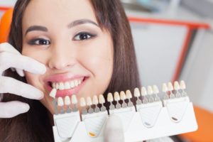 woman smiling beside porcelain veneers