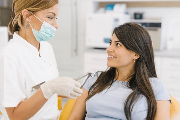 person speaking with cosmetic dentist