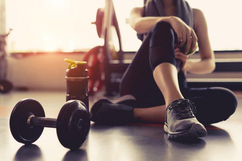 Woman takes break after workout